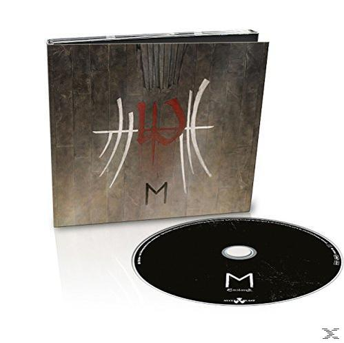 CD-Hülle und CD. Das Gehäuse hat den Buchstaben M und die CD auch den Buchstaben M.
