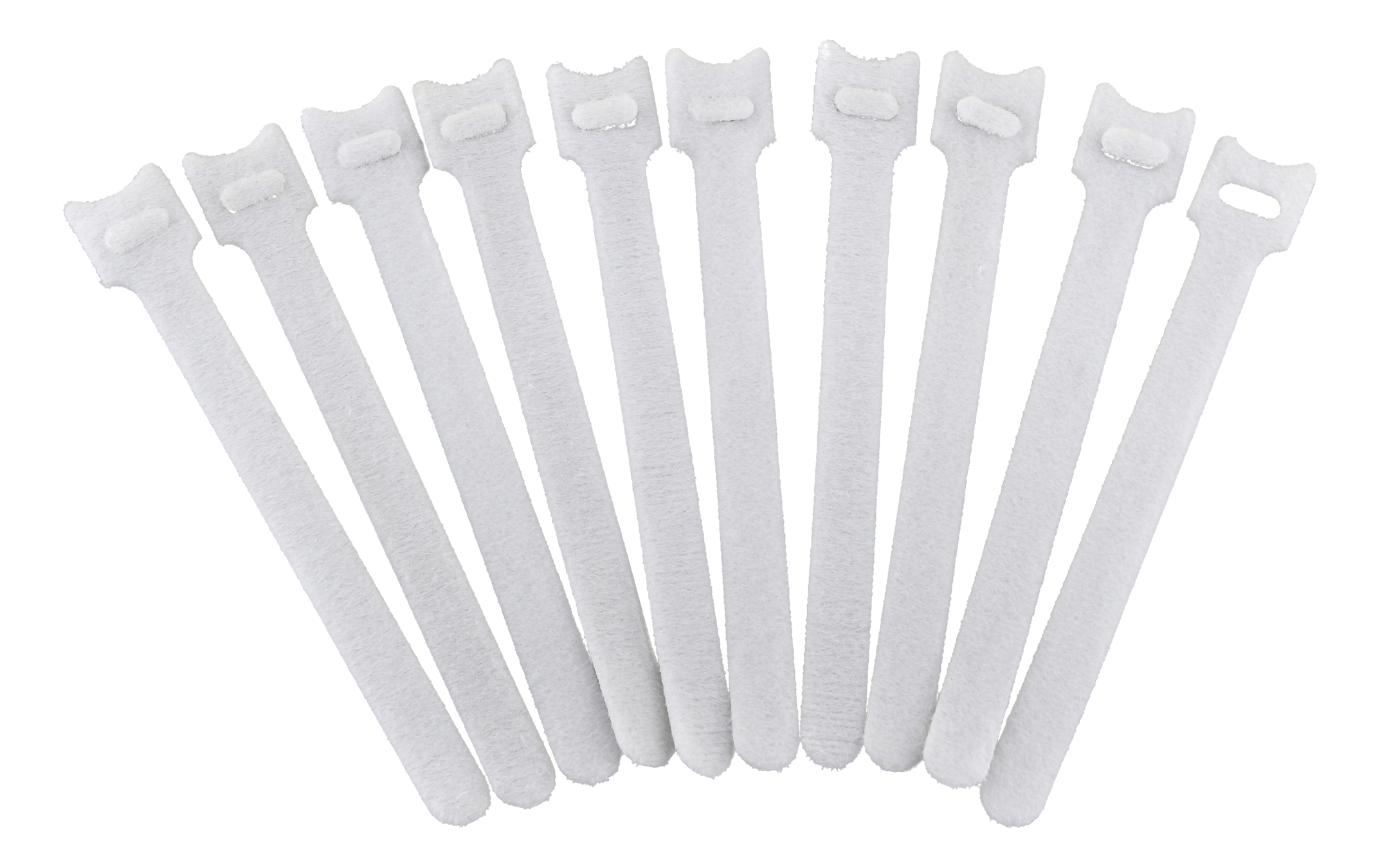 Fascette in velcro bianche. Sono sparse su uno sfondo nero.