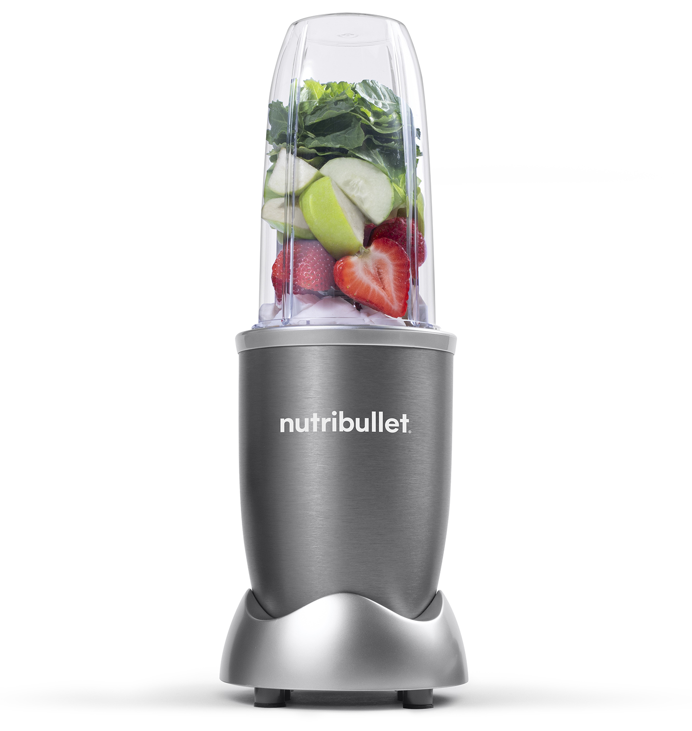 Nutribullet blender filled with fruits and vegetables on a white background.