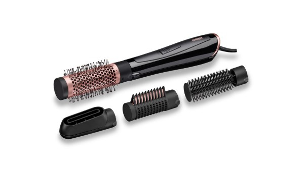 Outil de coiffure avec plusieurs accessoires : brosse, peigne et buse, sur fond blanc.