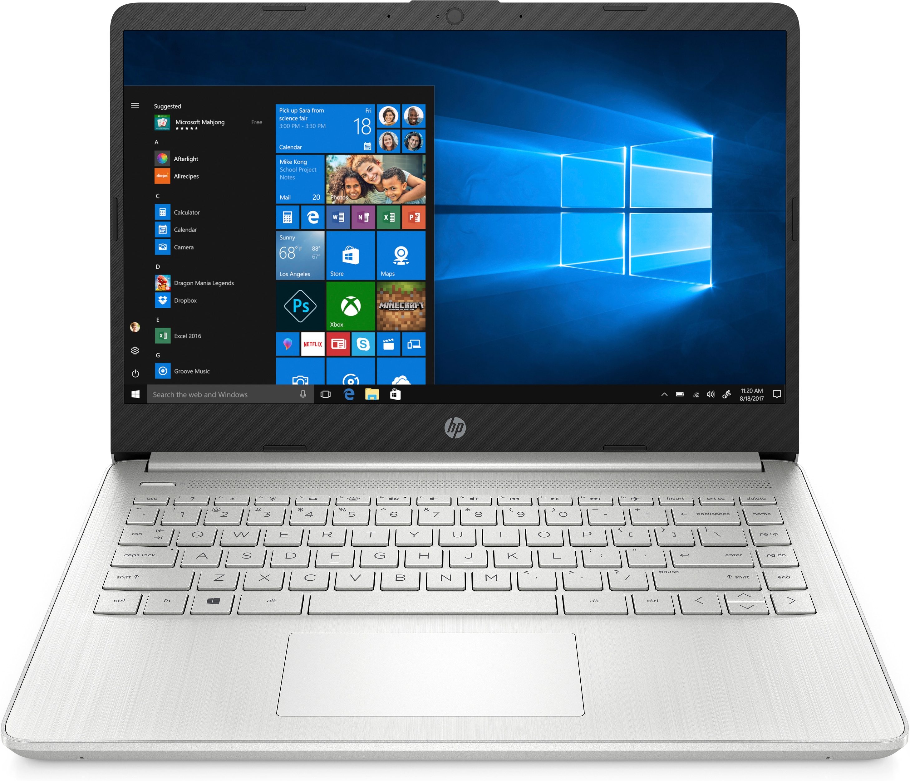 Portátil HP plateado con Windows 10, teclado visible. La pantalla muestra iconos de aplicaciones y la hora.