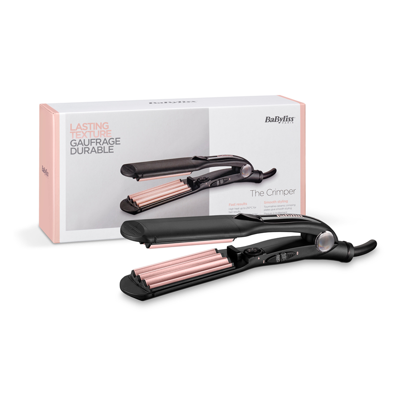 Une pince à cheveux noire et rose avec sa boîte.