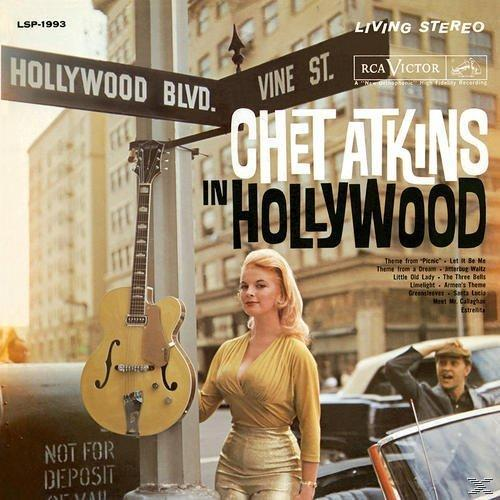 Album borító Chet Atkins-szel Hollywoodban. Egy nő sárga ruhában gitár és utcatáblák közelében.
