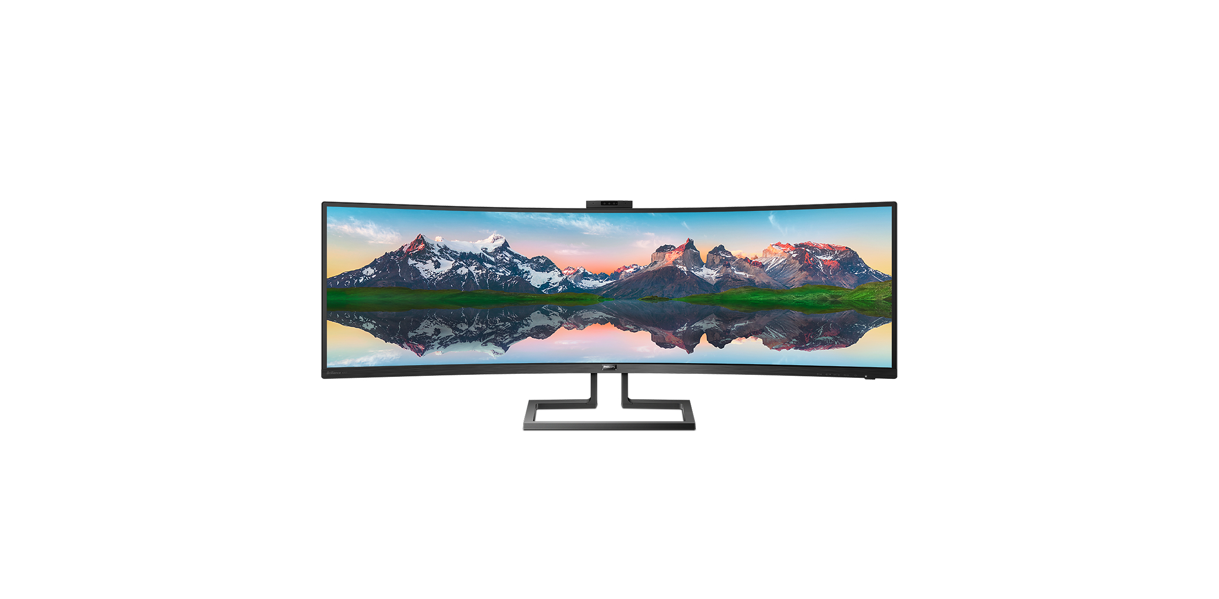 Un monitor Philips ampio e curvo mostra un panorama montano con cime innevate e riflesso nell'acqua.
