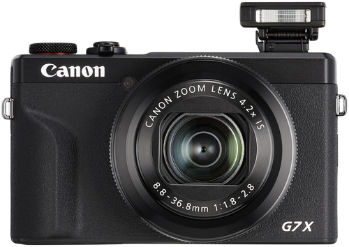 Fekete Canon G7X digitális fényképezőgép felugró vakuval és zoomobjektívvel.