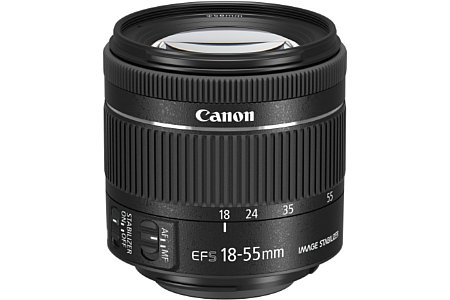 Primer plano de una lente Canon 18-55mm, negro con controles de enfoque y estabilización de imagen.