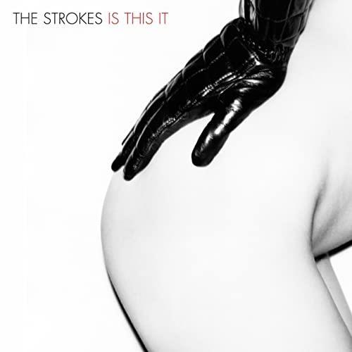 Album borító. Fekete bőrkesztyűs kéz meztelen fenéken. Szöveg: THE STROKES IS THIS IT.