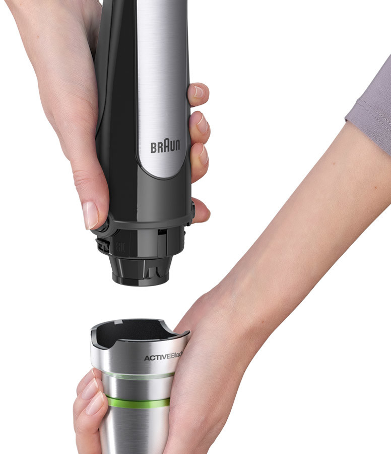 Hands assembling a Braun ActiveBlade hand blender.