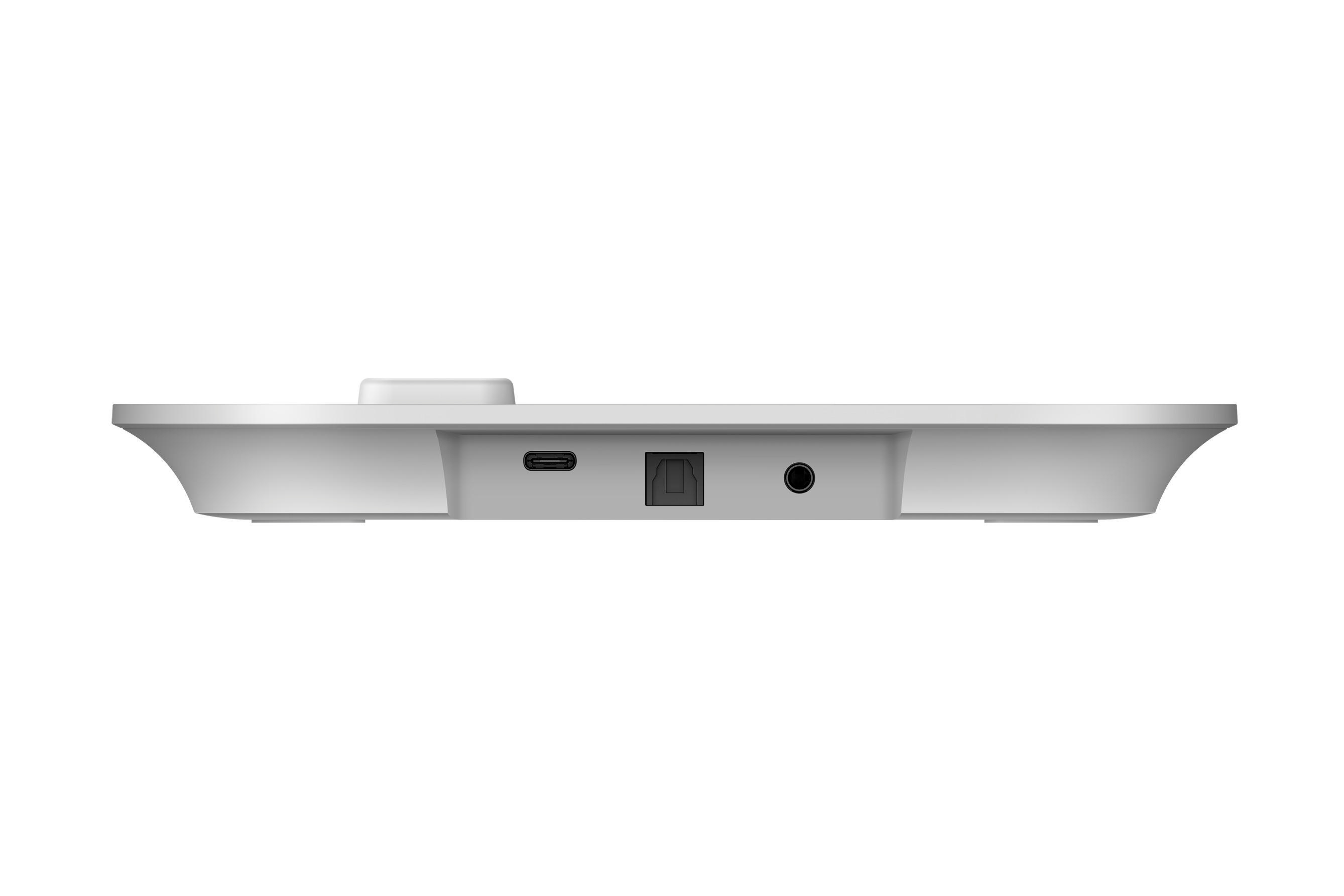Weißes Gerät, Seitenansicht. Anschlüsse für USB, optisch und Audio. Isoliert auf Weiß.