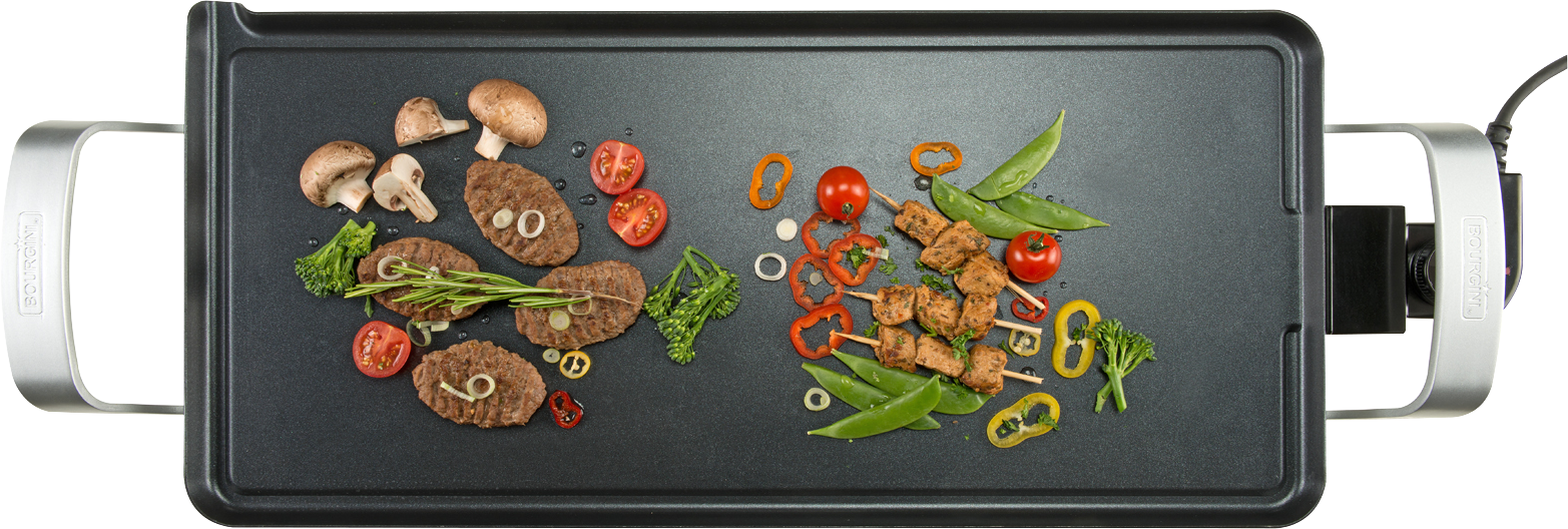 Electric griddle with cooked food: burgers, vegetables, and kebabs.