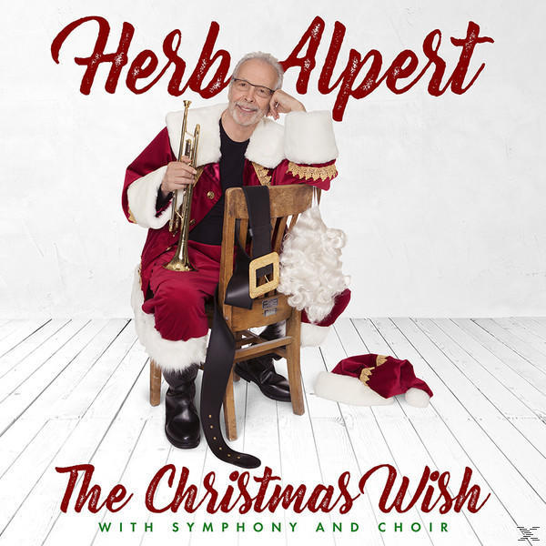Herb Alpert, Mikulás-ruhában, trombitát tartva, széken ülve, karácsonyi díszekkel. A cím látható.