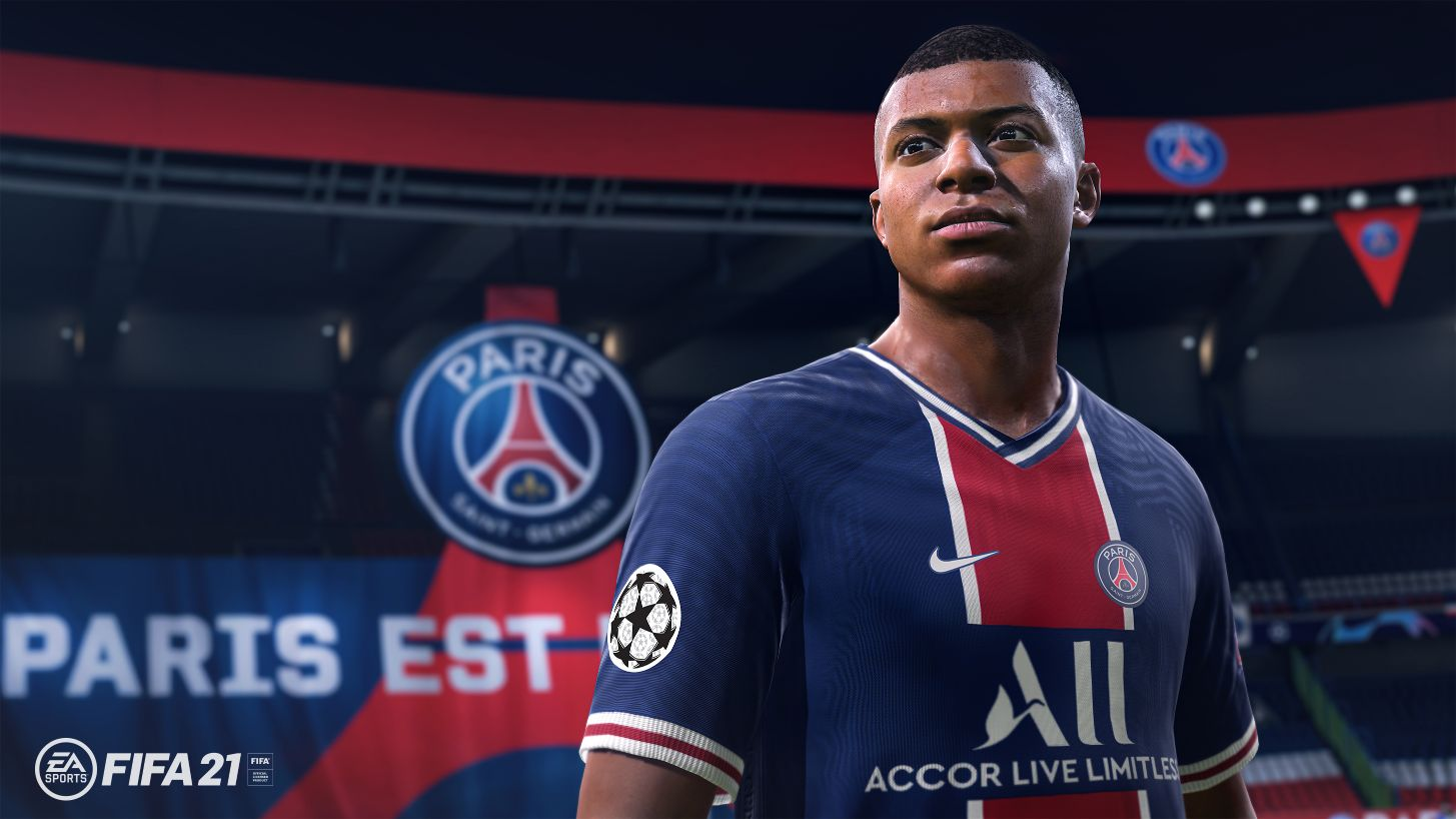 Un primer plano de Kylian Mbappé, un jugador de fútbol, vistiendo una camiseta azul.