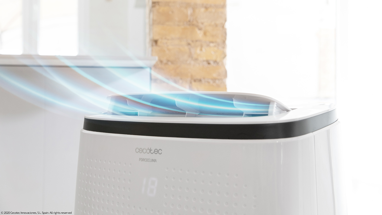 Air purifier with blue air currents, in a home setting. Features a digital display.
