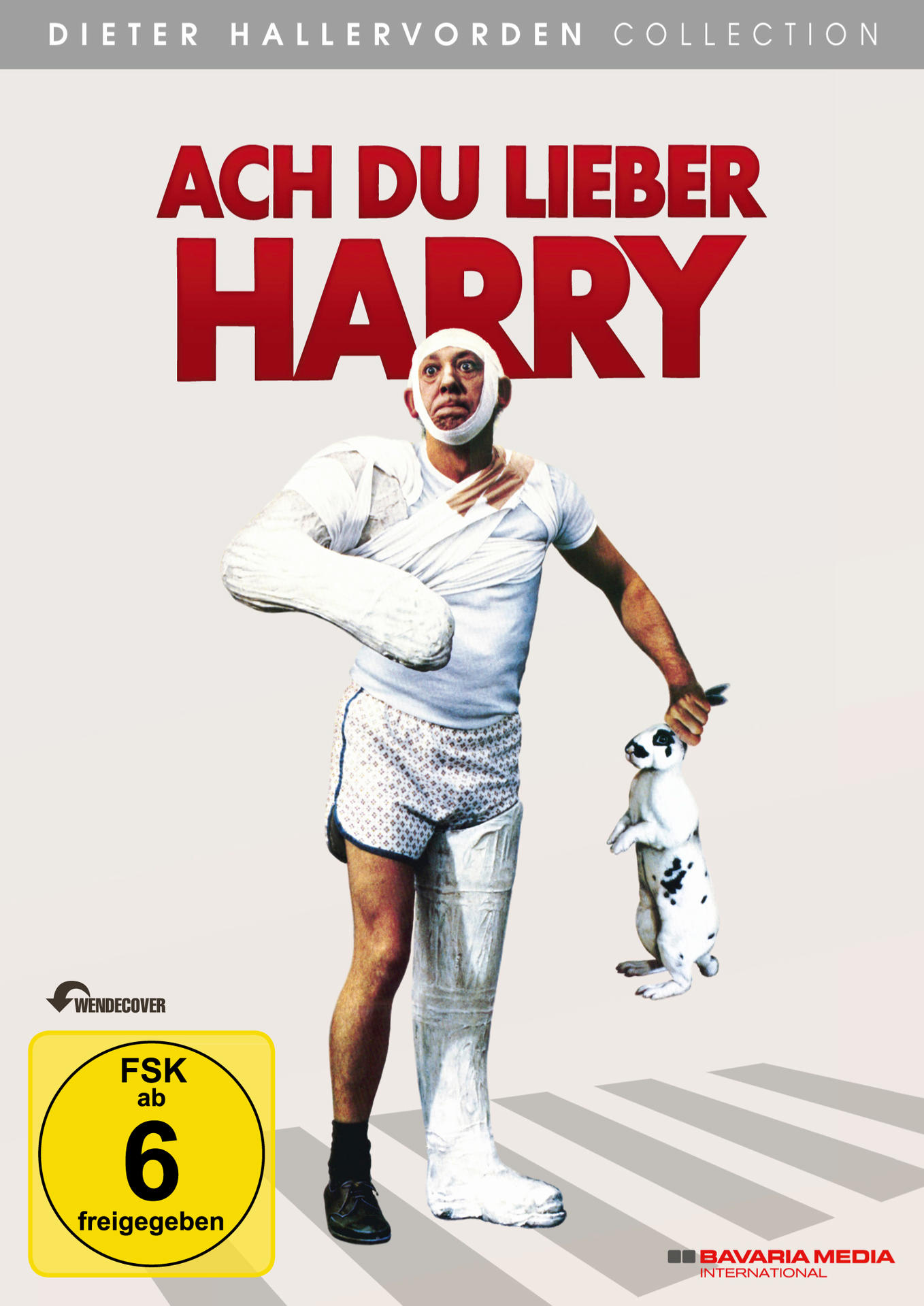 Filmposter mit einem bandagierten Mann, der ein Kaninchen hält, deutscher Text, gelbes Rating-Label.
