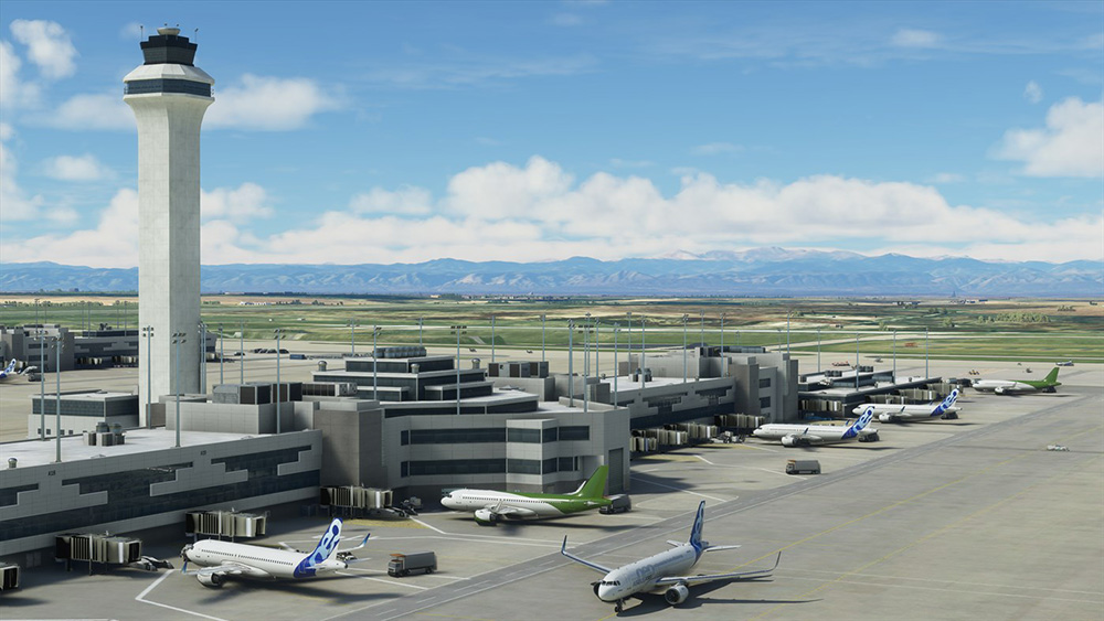 Scène d'aéroport. Tour de contrôle, avions garés, ciel bleu et nuages.