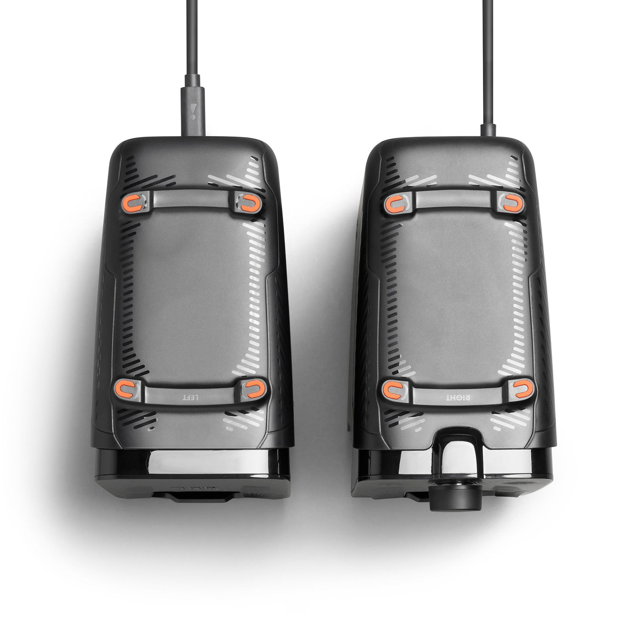 Two black speakers, each with a charging port, and an orange accent.