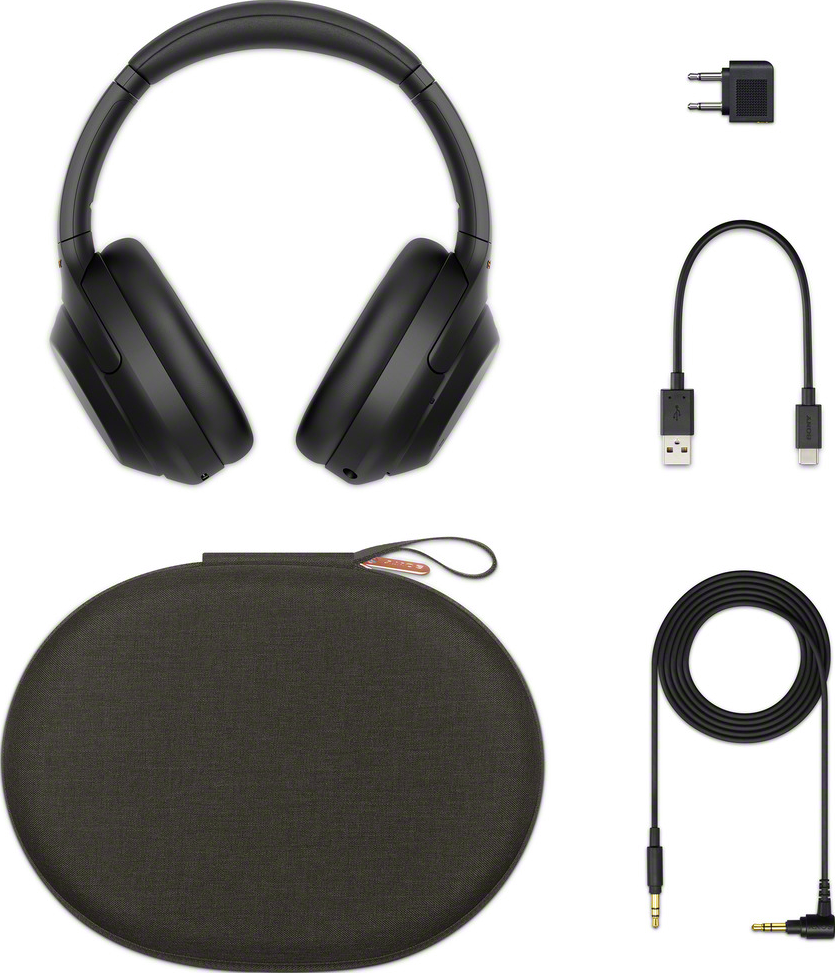 Cuffie nere, custodia e cavi. Le cuffie sono over-ear con archetto.