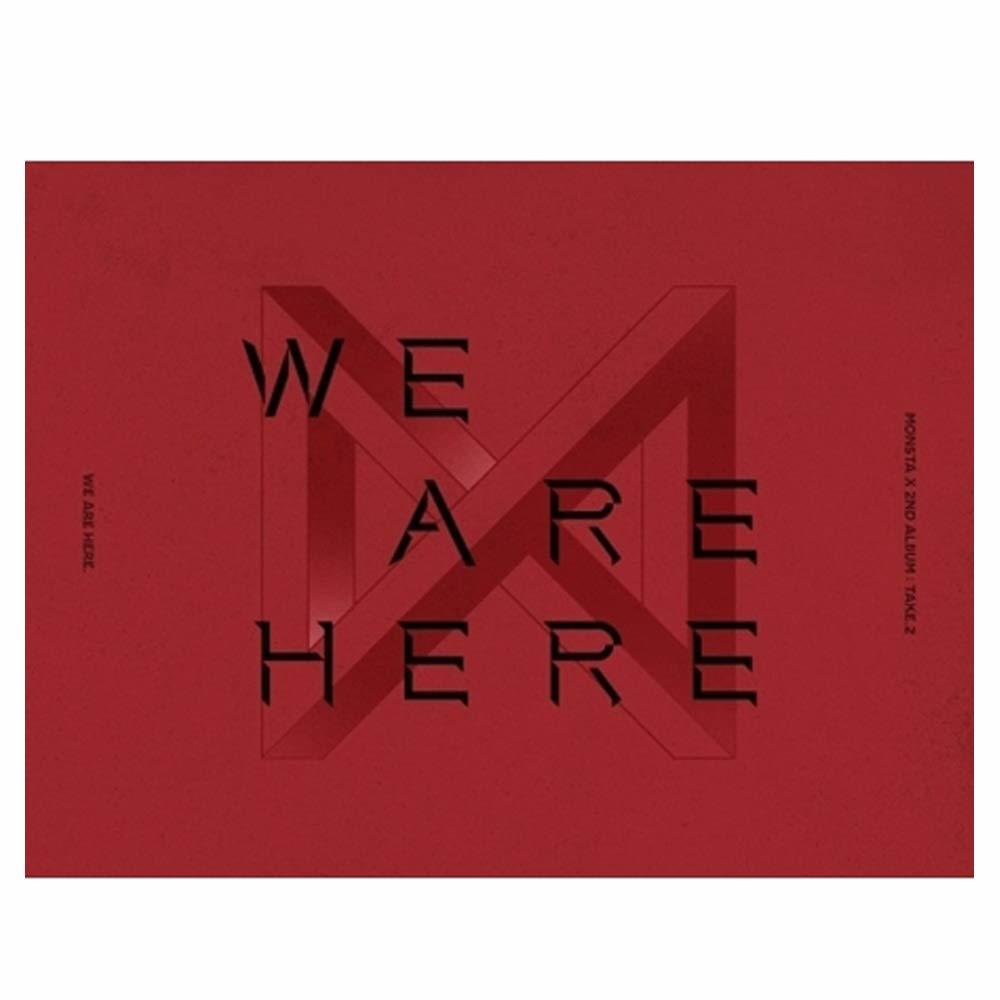 Rode albumhoes met de zwarte woorden "WE ARE HERE". De groepsnaam is aanwezig.