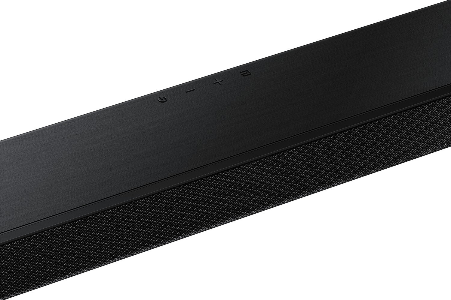 Una barra de sonido negra elegante con botones de encendido, subir y bajar volumen. Fondo blanco.