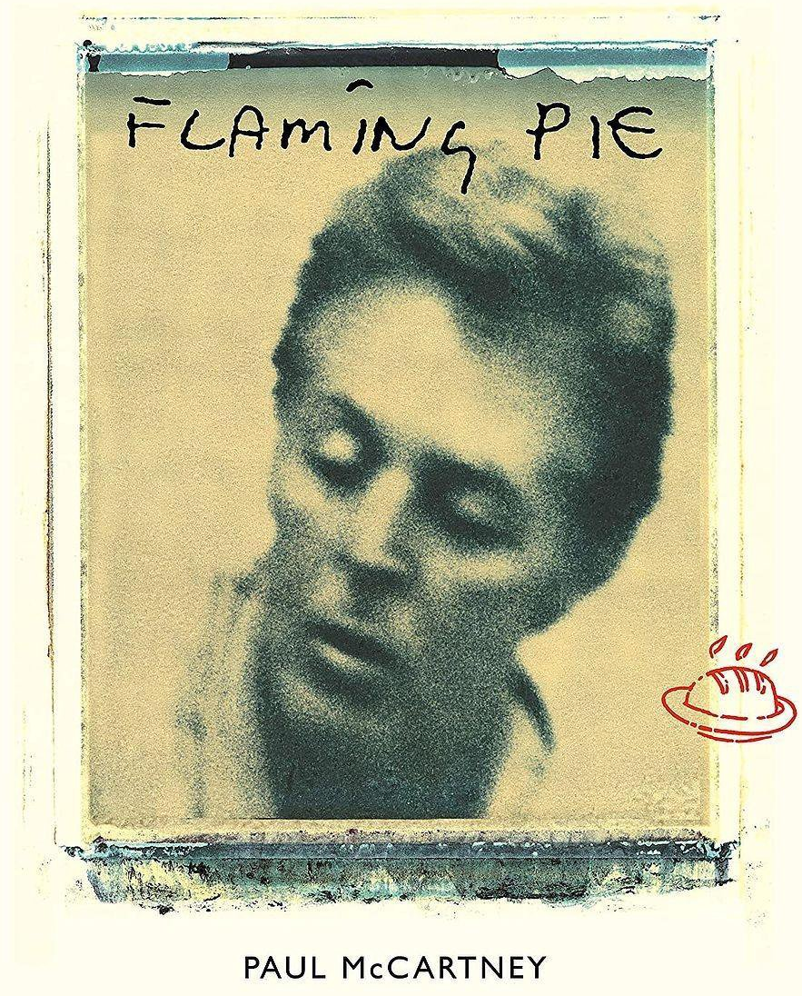 Albumhoes van Paul McCartney's Flaming Pie. De afbeelding is een zwart-witfoto met de titel erboven.