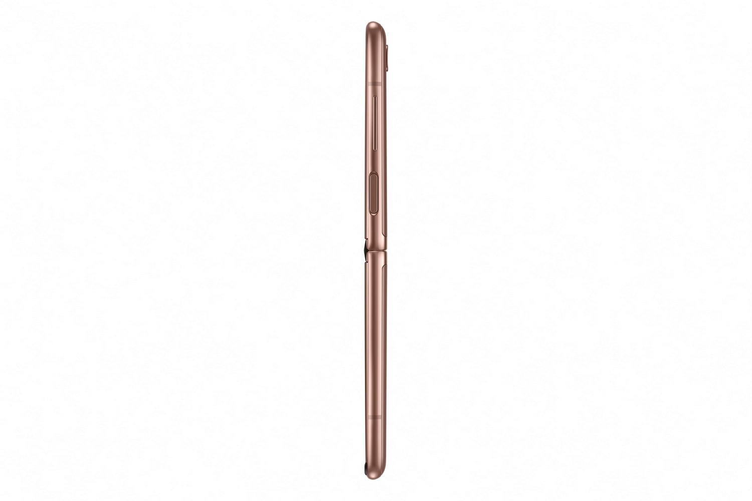 Un teléfono plegable cerrado, color oro rosa, visto de lado.