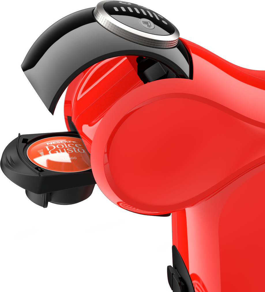 Una macchina da caffè Dolce Gusto rossa con una capsula di caffè che viene inserita.