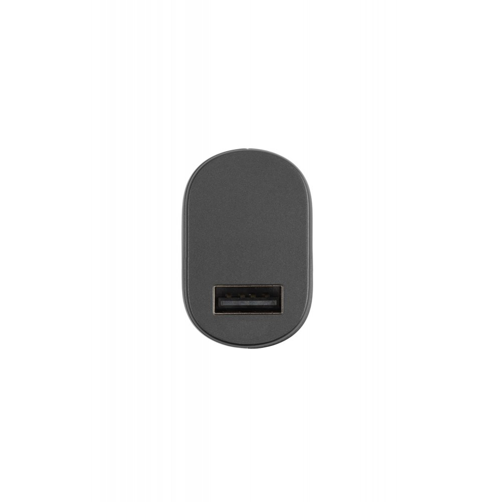 Ein schwarzes USB-Ladegerät liegt auf weißer Oberfläche.