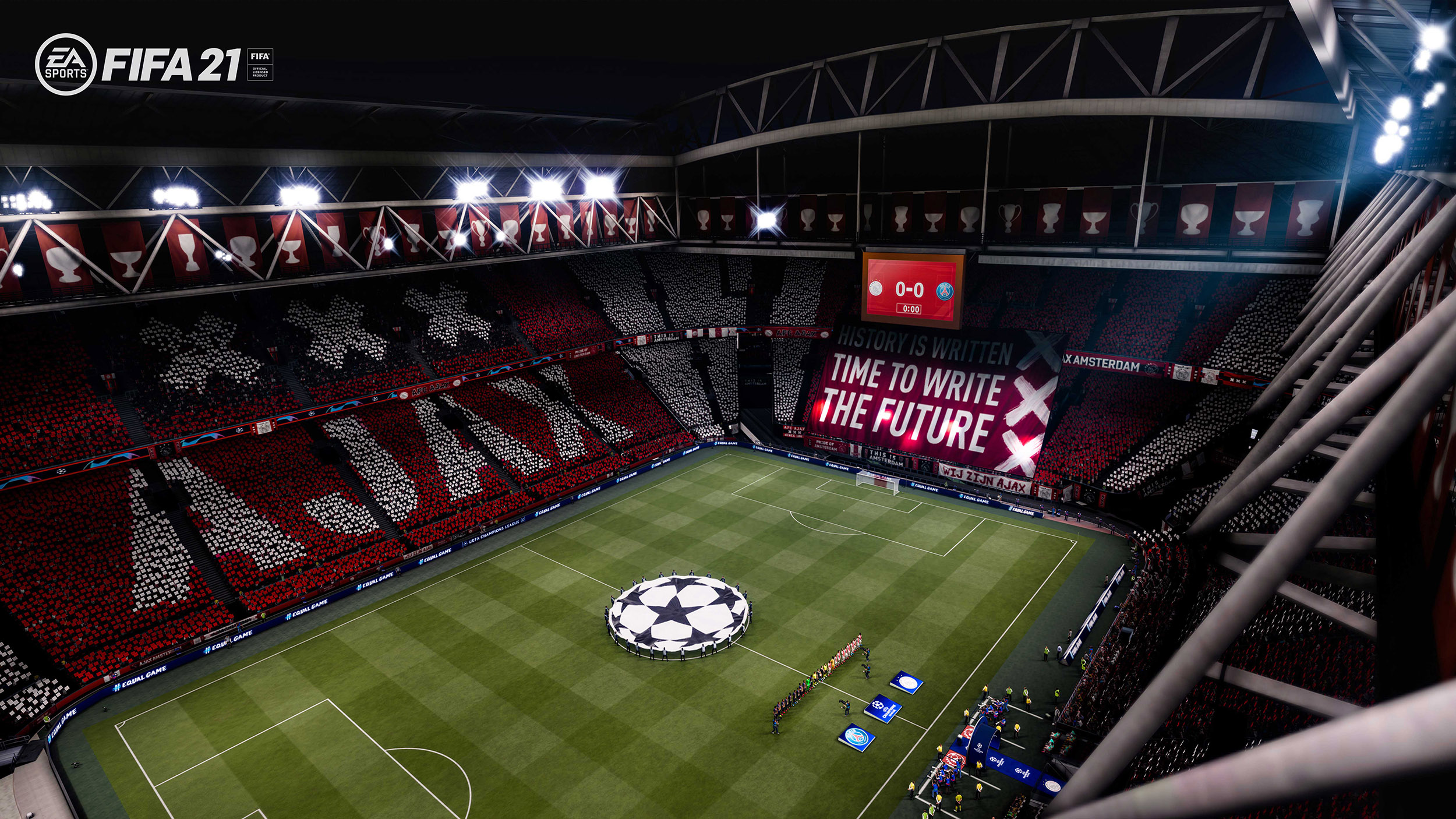 Een voetbalstadion met een groot scherm en een groen veld. De tribunes zijn vol.