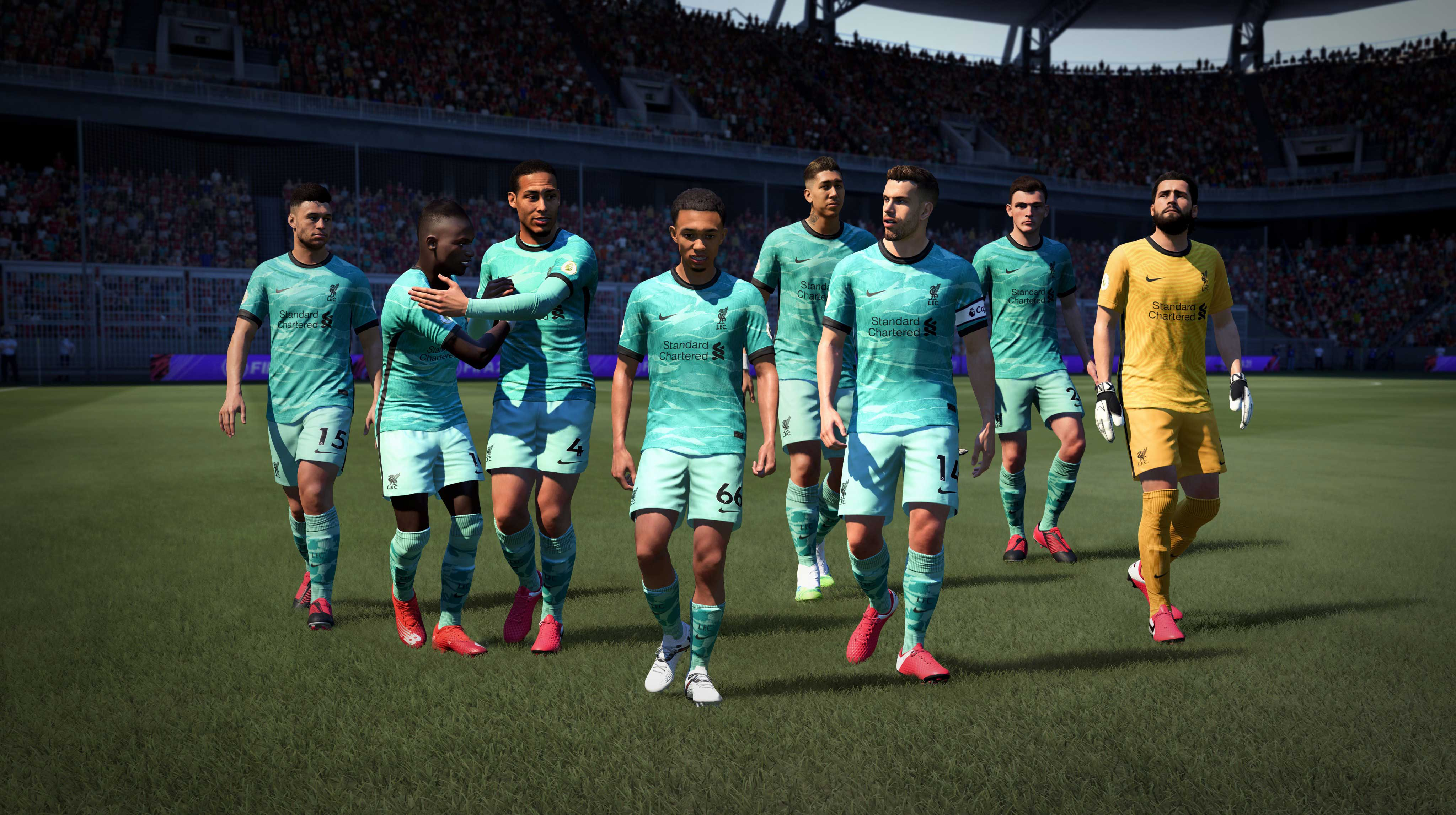Een groep voetballers in blauwgroene uniformen op een veld.