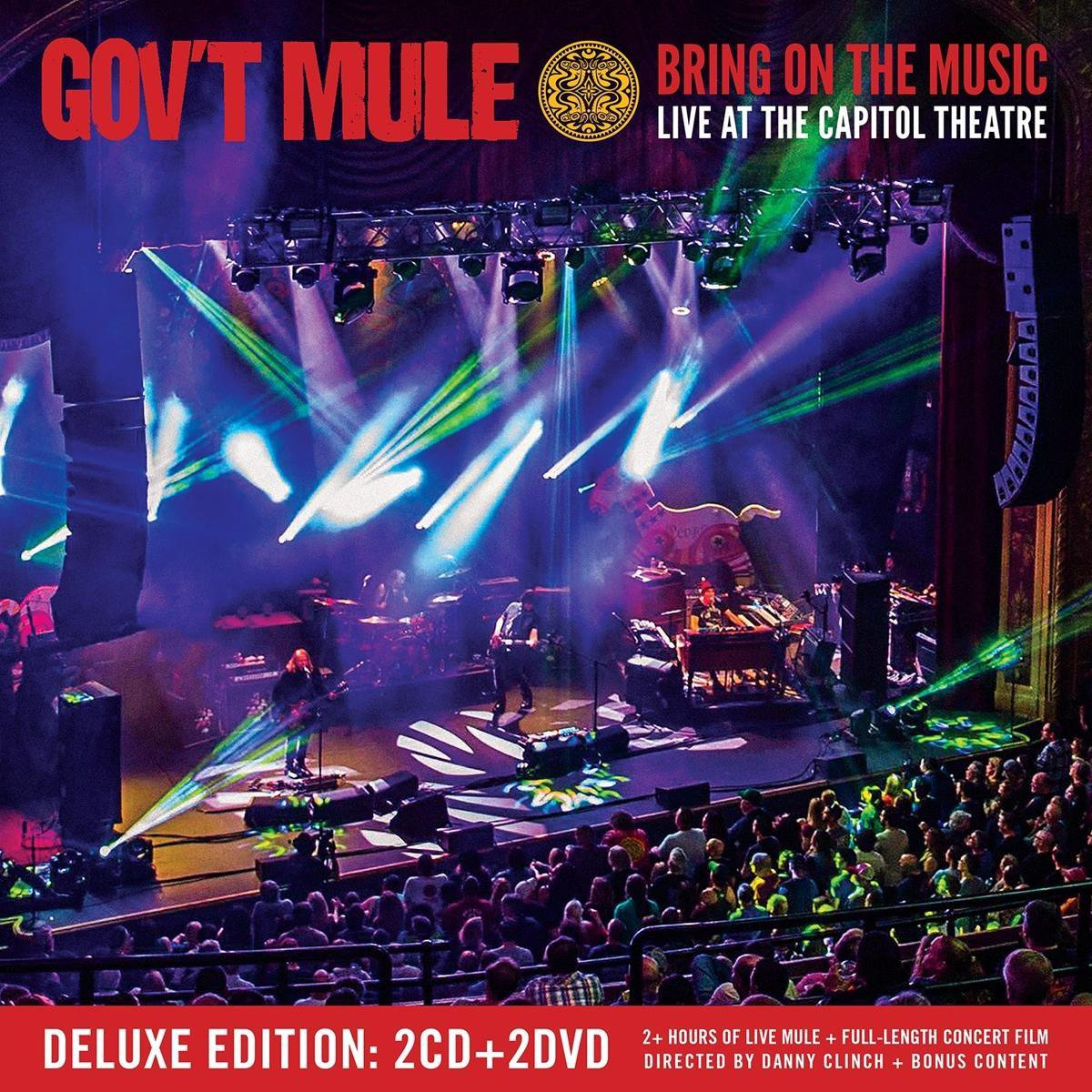 Pochette de l'album Gov't Mule. Groupe sur scène avec des lumières, foule au premier plan et titre en haut.