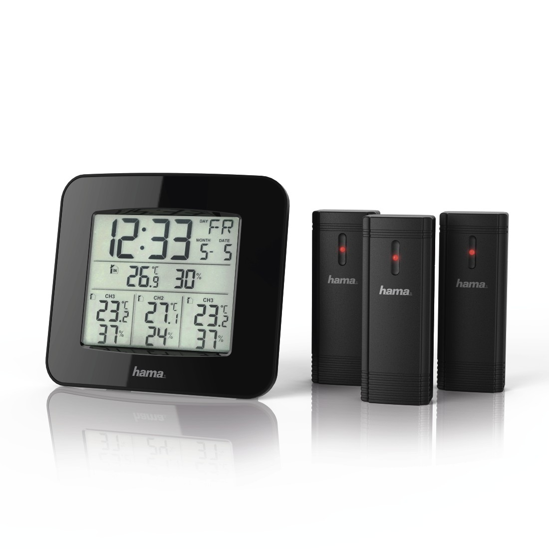 Black digital clock with temperature sensors. Three sensors are on the right side.
