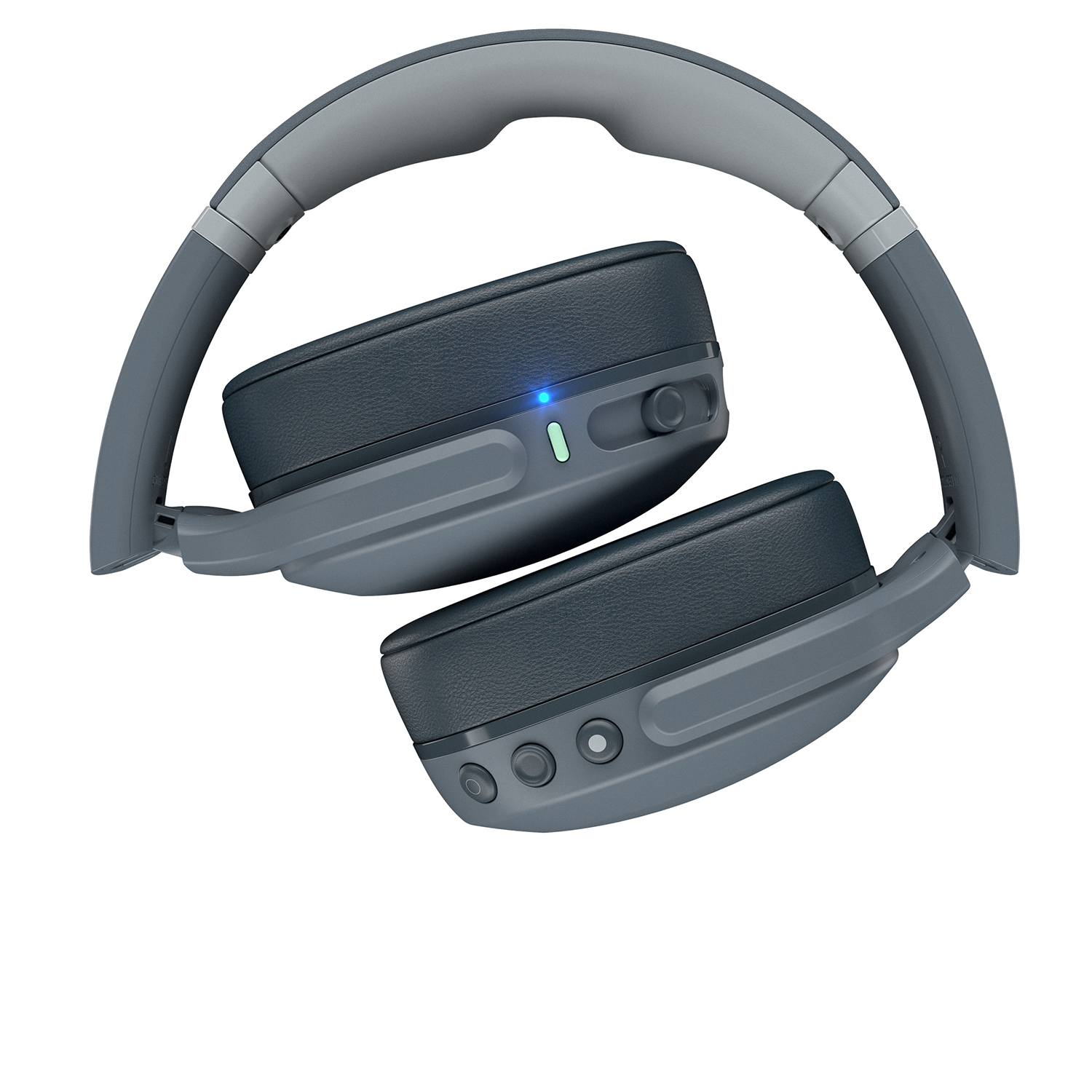 Gray headphones, folded. Dark grey earcups, blue light on one. White background.