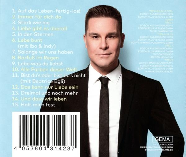Albumcover mit Mann im Anzug und Krawatte, Text und Barcode.
