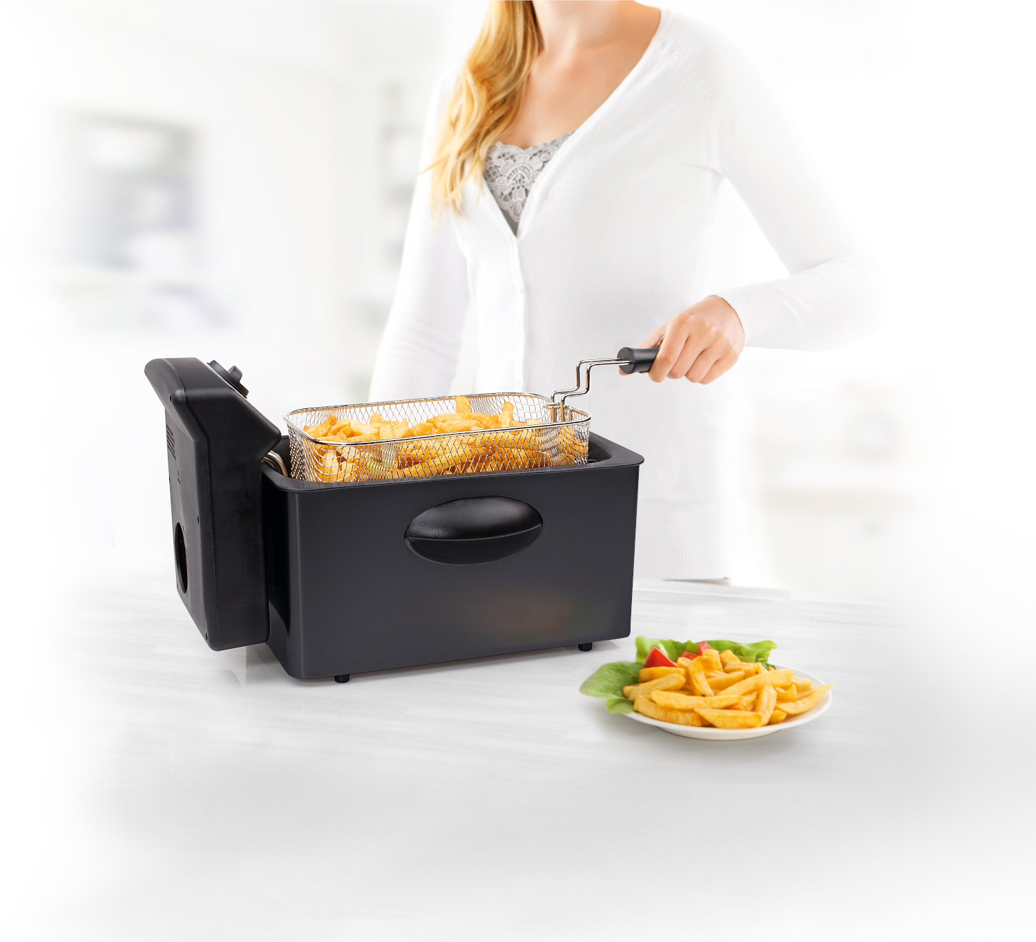 Woman with a deep fryer, fries in a basket and a plate of fries. White background.