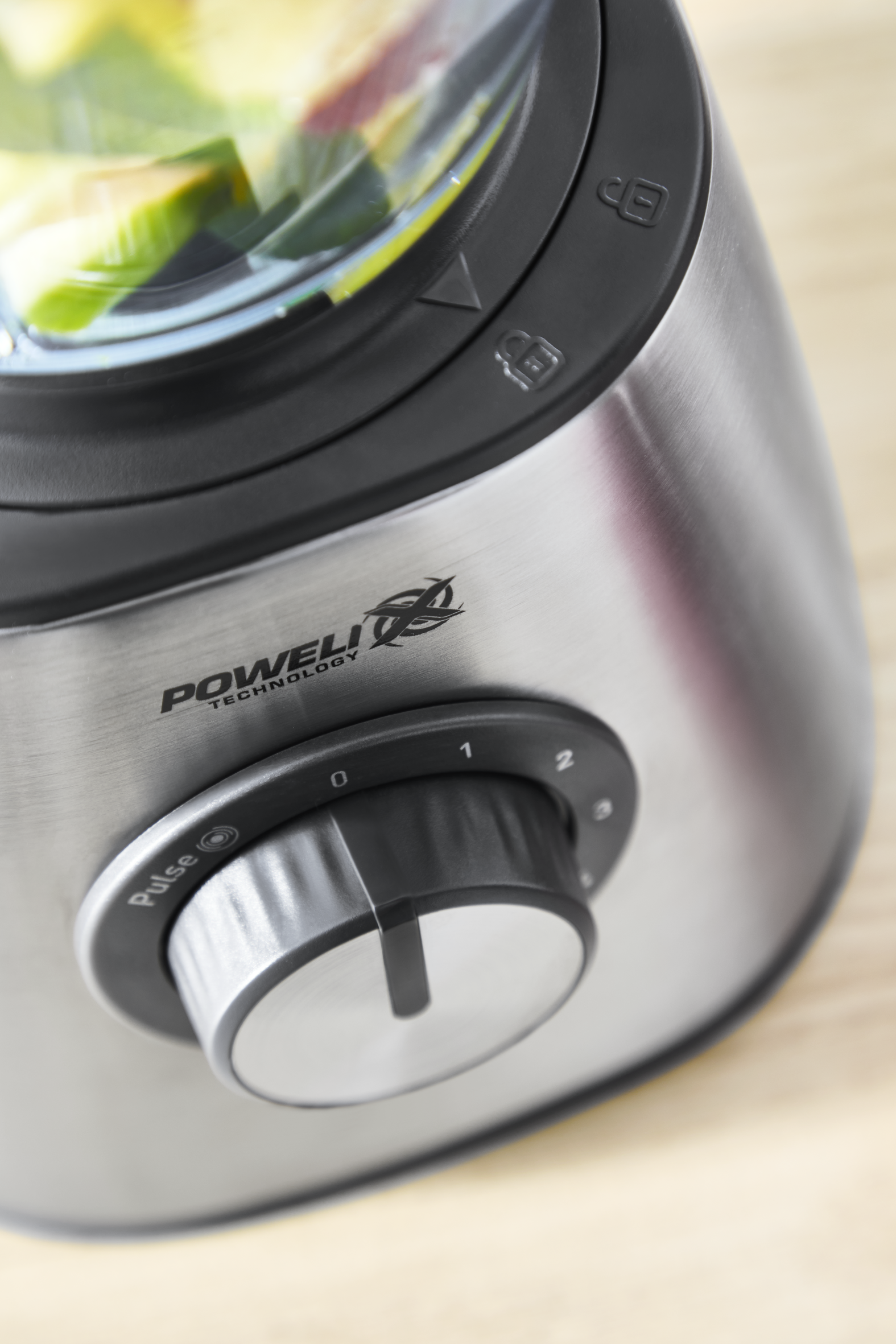 Close-up of a silver and steel blender with a black control panel and the word 'Poweli' and 'Technology'.