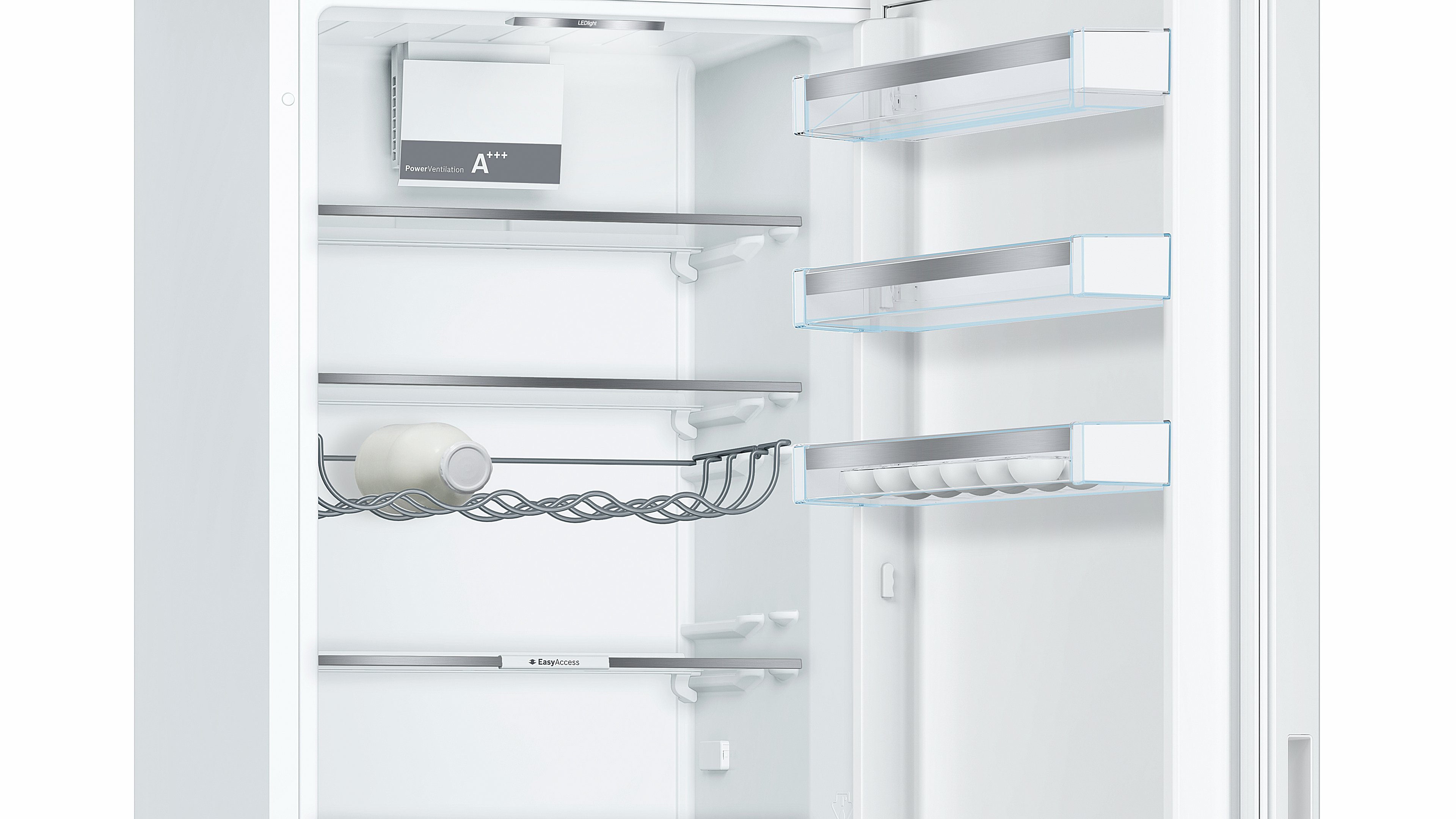 Open white refrigerator interior with shelves, bottle rack, egg rack, and power vent label.