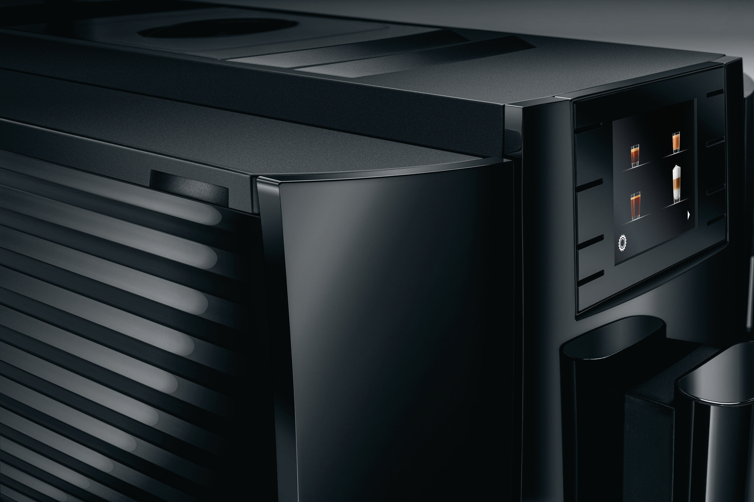 Schwarze Kaffeemaschine mit Touchscreen-Display. Hat eine geschwungene Front und ein schlankes, modernes Design.