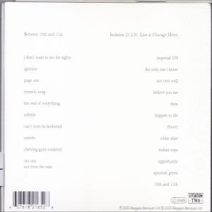 Text auf weißem Hintergrund mit Songtiteln und Credits. Text in zwei Spalten.