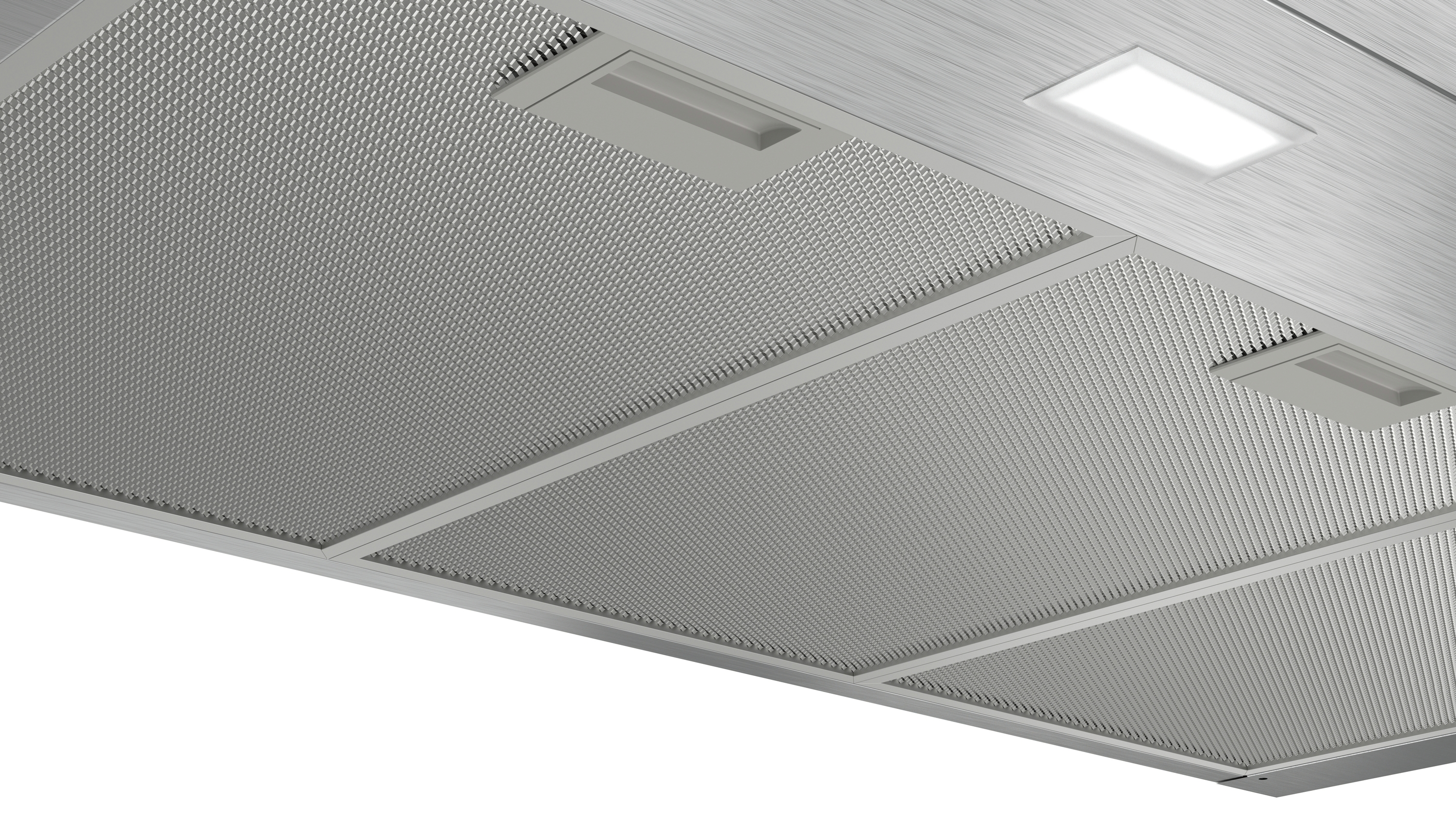 Close-up of a stainless steel range hood, showing the mesh and lights.