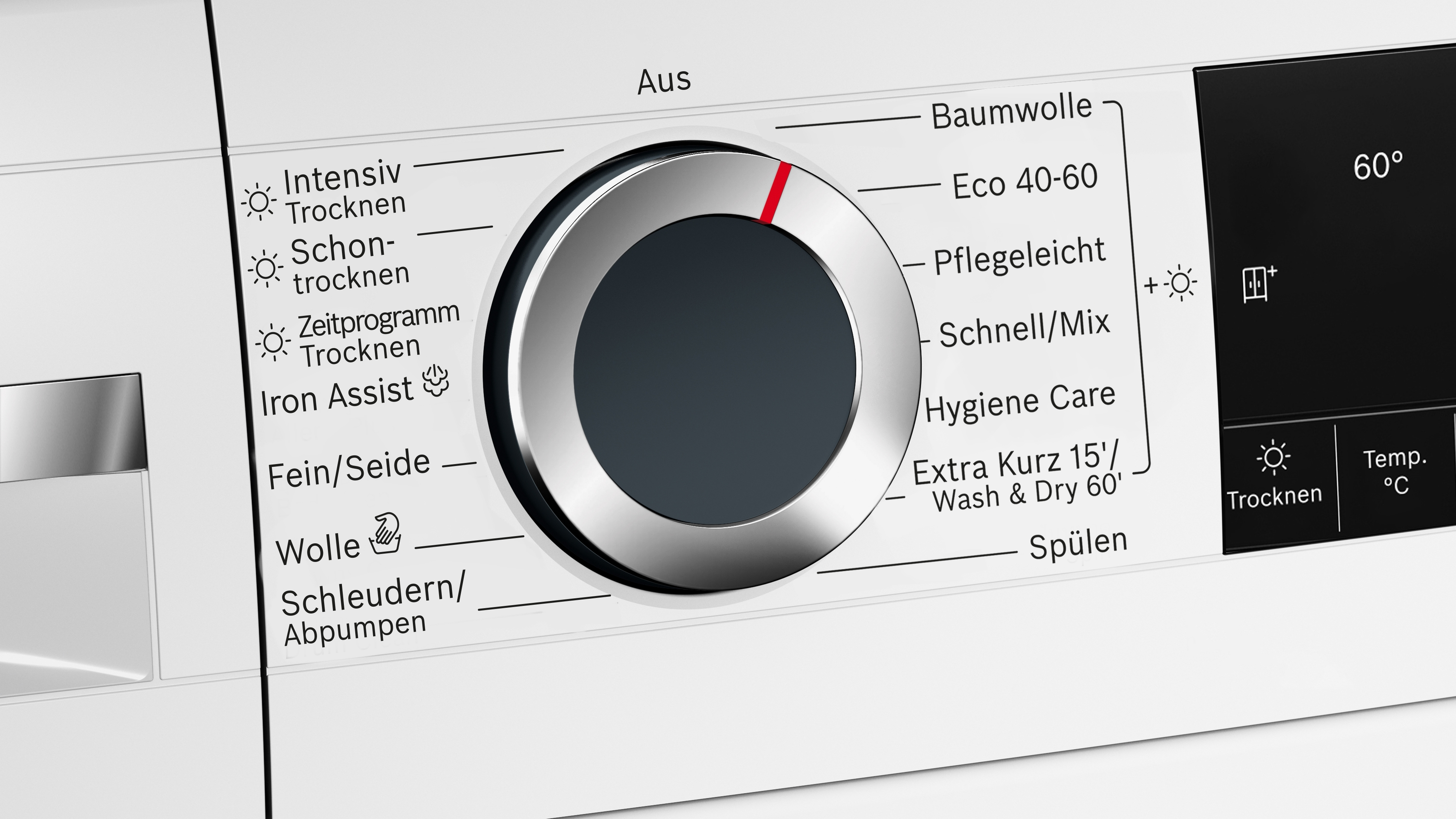 Nahaufnahme des Bedienfelds einer Waschmaschine. Ein Drehregler zeigt Waschprogramme an, ein Display Einstellungen und Temperatur.