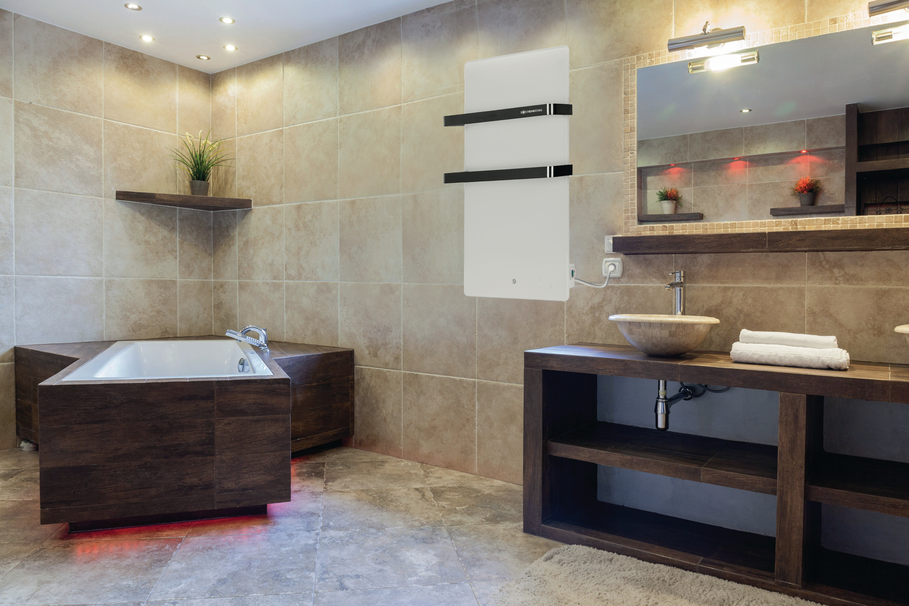 Ein modernes Badezimmer mit einem weißen elektrischen Heizkörper, einem Waschbecken, einer Badewanne und einem Spiegel.