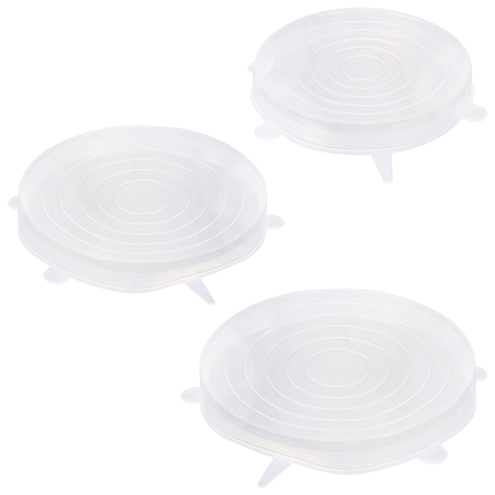 Tres tapas de silicona transparentes para alimentos sobre un fondo blanco.