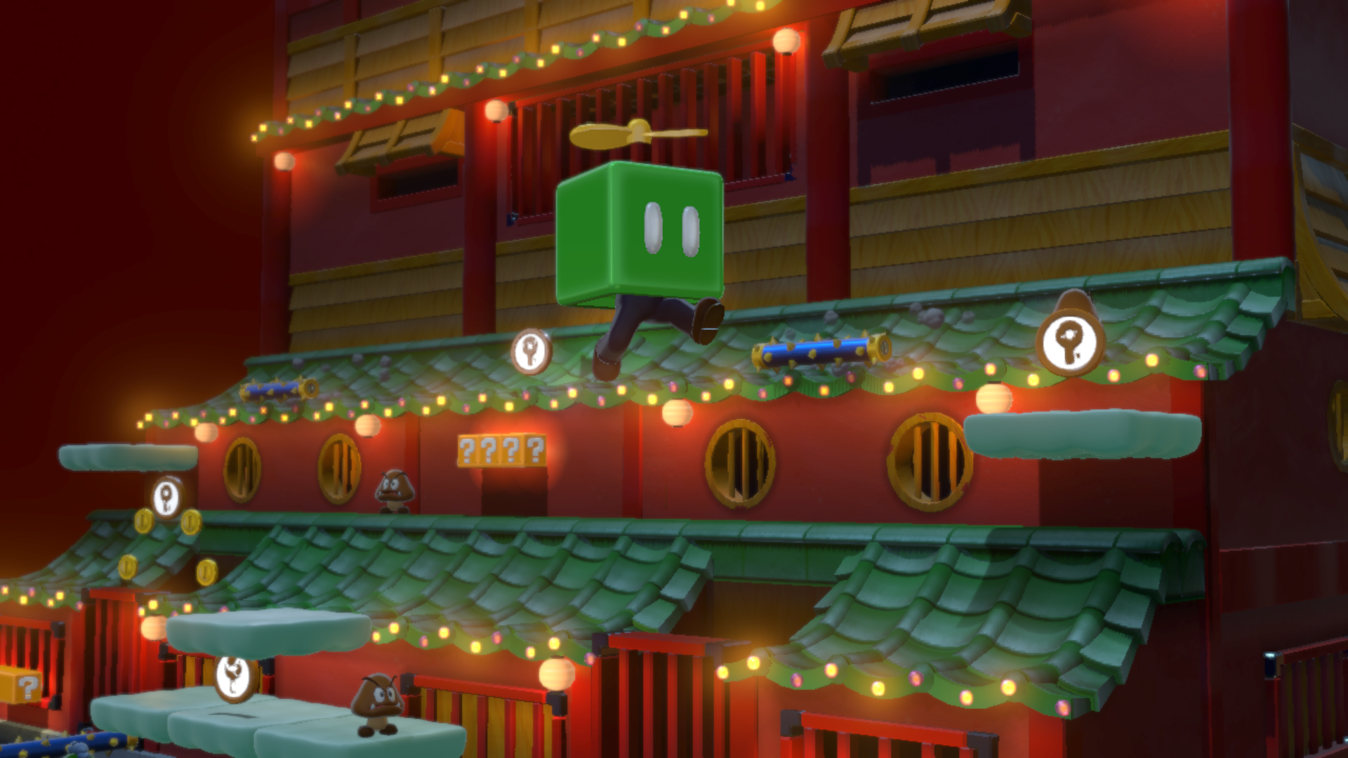 Un personaggio a cubo verde che salta su un edificio.