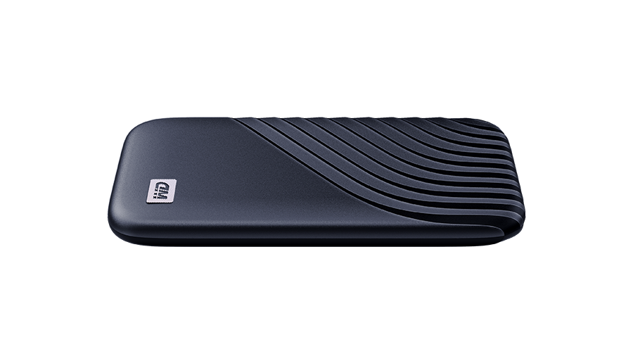 A black external hard drive with a textured wave design on top, against a black background.