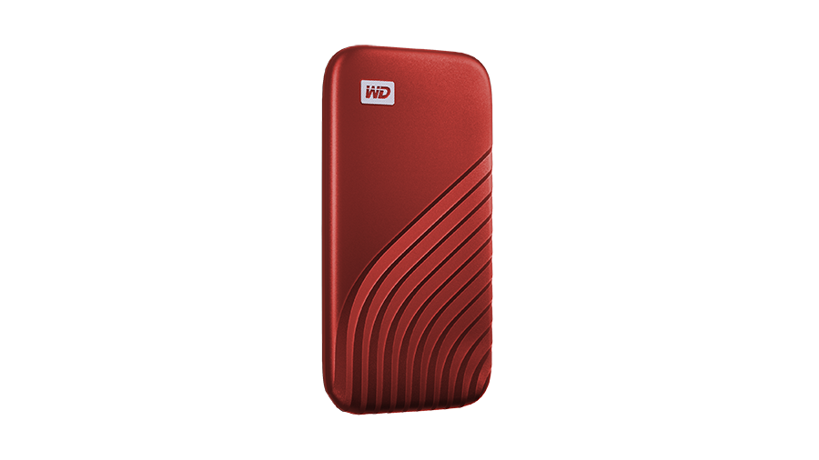 A red WD external hard drive on a black background. The drive has a ridged design.