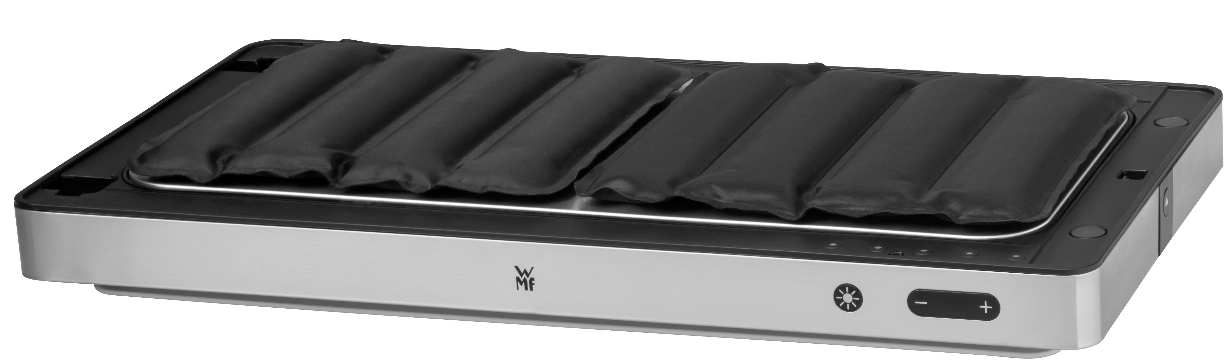 Ein silberner und schwarzer Grill mit schwarzen rechteckigen Pads, mit Bedienelementen rechts.