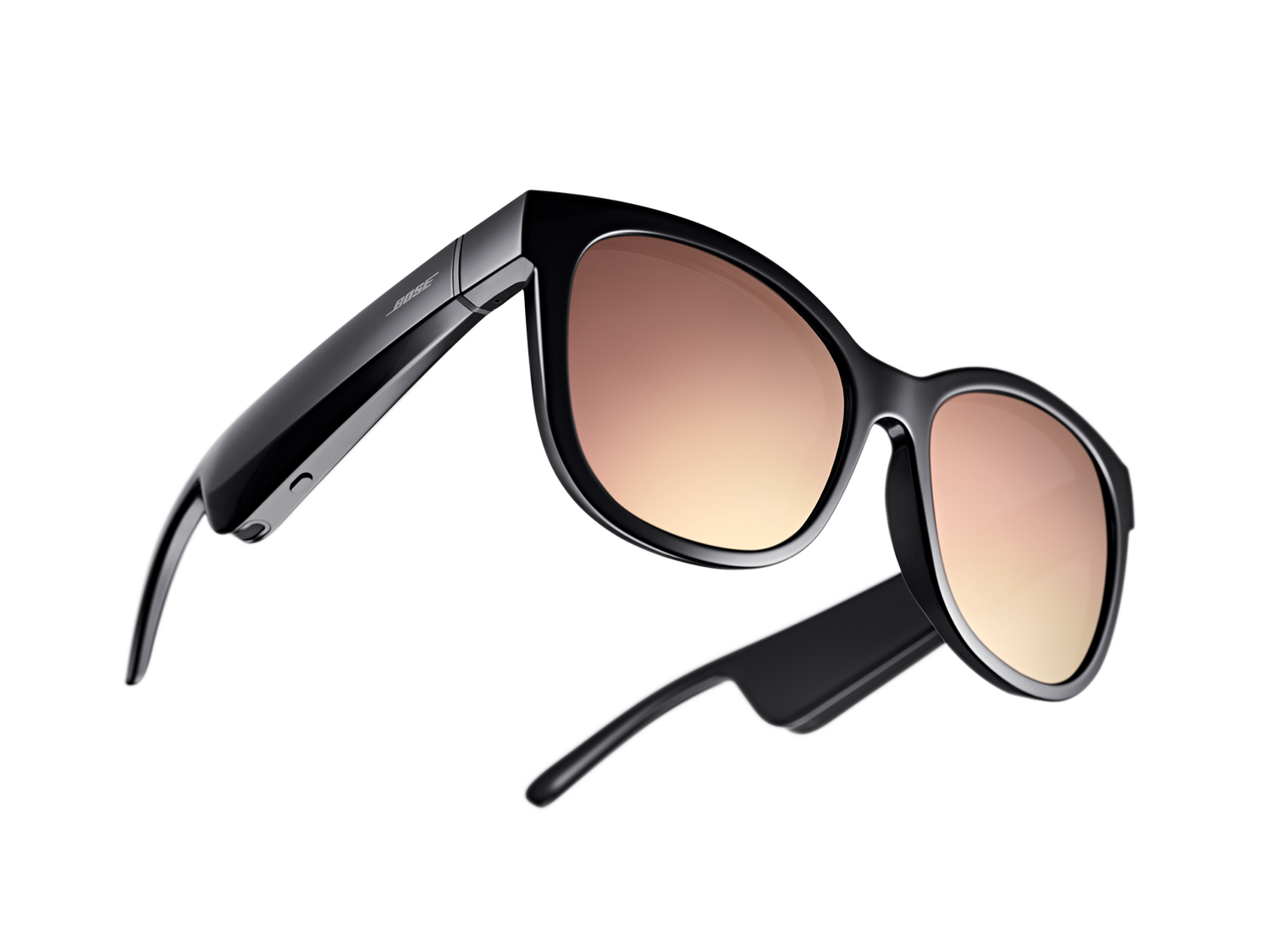 Black audio sunglasses with brown lenses, angled view.