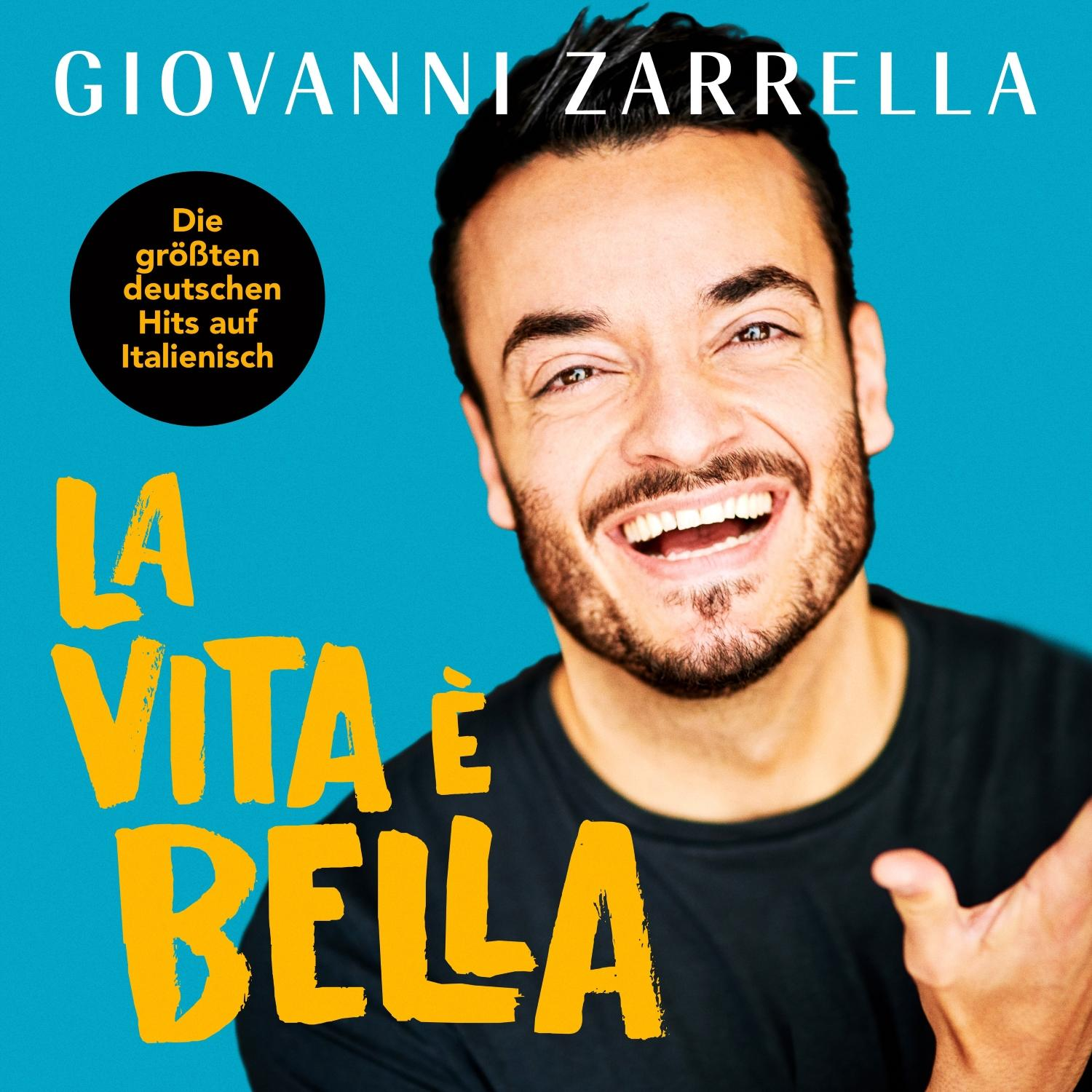 Albumcover eines lächelnden Mannes mit dem Text 'La Vita e Bella'.