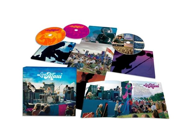 CD-set: albums en schijven met concertfoto's. Kleurenpalet omvat oranje, paars en blauw.