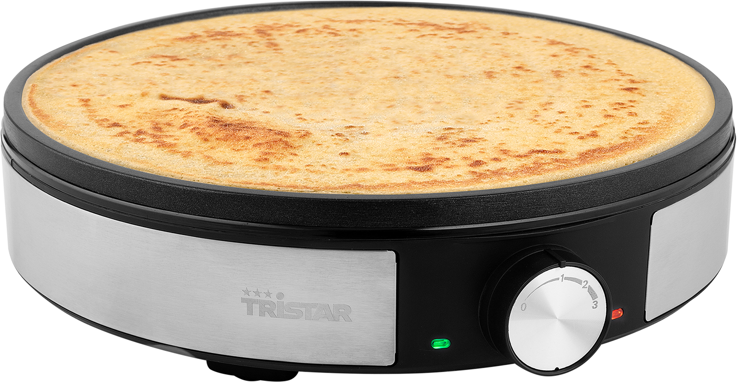 Crepe maker. A round black and silver appliance with a cooked crepe inside.